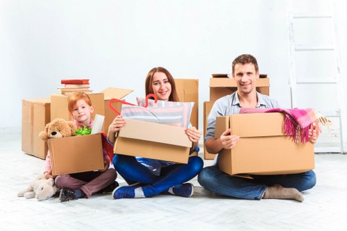 Flat removals team planning a move in Newcross apartment building
