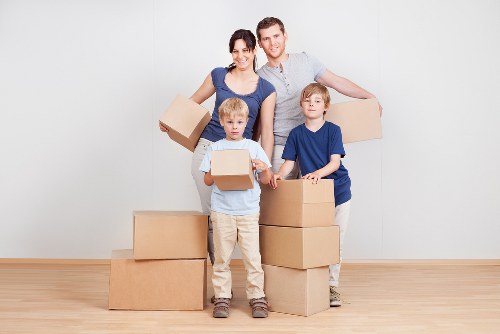 Professional movers handling furniture in Newcross