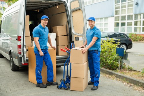 Professional movers handling bulky furniture during relocation
