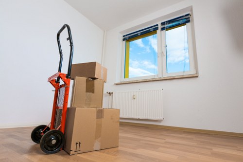 Packed moving boxes and furniture ready for house removals