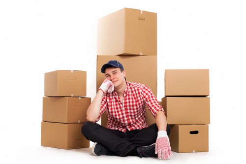 Packed office furniture and IT equipment ready for Newcross removals